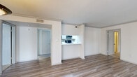 Located at 100 Hollow Tree Ln in Houston, TX, this single-floor, 2-bedroom, 2-bathroom home offers a practical and well-organized layout. The open living area features durable wood-look flooring and crown molding, creating a clean, inviting atmosphere. A pass-through kitchen connects seamlessly to the living space, showcasing white cabinetry, a tile backsplash, black appliances including a refrigerator and electric range, and a breakfast bar that doubles as additional counter space.

Both bedrooms are carpeted and equipped with ceiling fans and dedicated closets, providing comfortable retreats. The spacious primary bedroom offers a generous footprint, ideal for a variety of furniture arrangements. Each bathroom features a full tub-shower combo, a vanity with storage, and wood-look flooring that ties in cohesively with the rest of the home.

A dedicated laundry room with a full-size washer and dryer adds everyday convenience, while a central hallway connects all rooms efficiently. Crown molding details and neutral tones throughout contribute to a bright, cohesive aesthetic. The single-floor design ensures easy accessibility across all spaces, making this home a functional and comfortable residence in Houston.