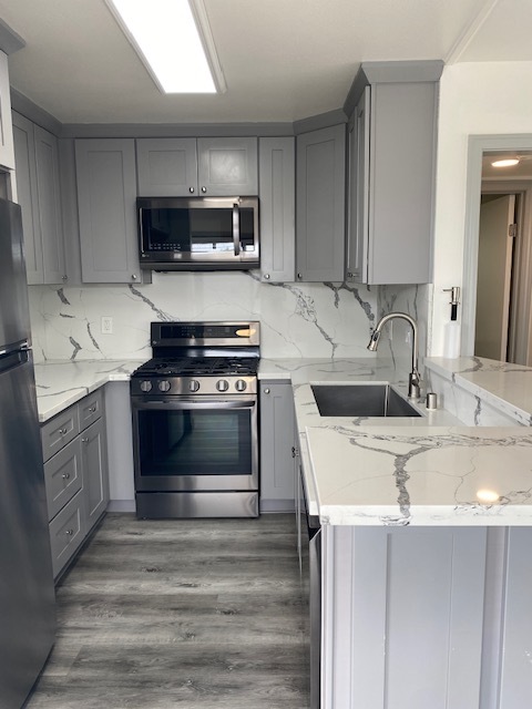 Kitchen with Granite Countertops and Stainless Steel Appliances - 121 Gull St