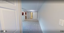 This well-designed apartment in Alexandria, VA offers 760 square feet of living space on a single floor. The layout includes two bedrooms, with the primary bedroom boasting a generous 250 square feet. The open-concept living area seamlessly integrates with the kitchen, creating a spacious feel.

Throughout the apartment, large windows allow ample natural light to flood the rooms, enhancing the sense of space. The neutral color palette, featuring light gray walls and white trim, contributes to a bright and airy atmosphere. Plush carpeting in the bedrooms and living areas adds comfort underfoot.

The kitchen showcases modern amenities with stainless steel appliances, including a side-by-side refrigerator and built-in microwave. Dark wood cabinetry contrasts beautifully with the granite countertops, while a window above the sink provides natural light and ventilation.

Ample storage is available throughout, with large closets in the bedrooms and additional built-in storage in the living area. The apartment's layout is efficient, maximizing usable space while maintaining a feeling of openness.

A sliding glass door in the living room leads to an outdoor area, extending the living space and offering a connection to the surroundings. The property at 5104 Celtic Dr combines modern comforts with a practical layout, creating an inviting home in a convenient Alexandria location.