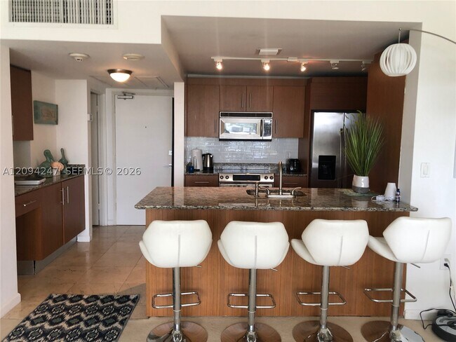 Building Photo - 10275 Collins Ave