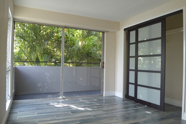 Napili Towers bedroom with closet and glass doors to the balcony - Napili Towers