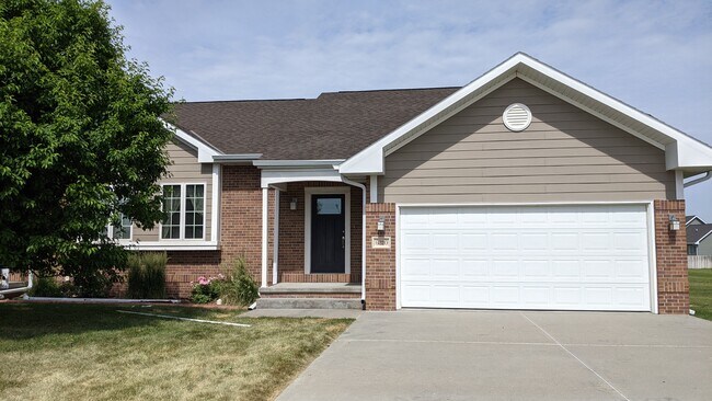 2-bedroom, 2-bathroom townhome with an attached garage and unfinished basement. - 6310 Avenue M Pl