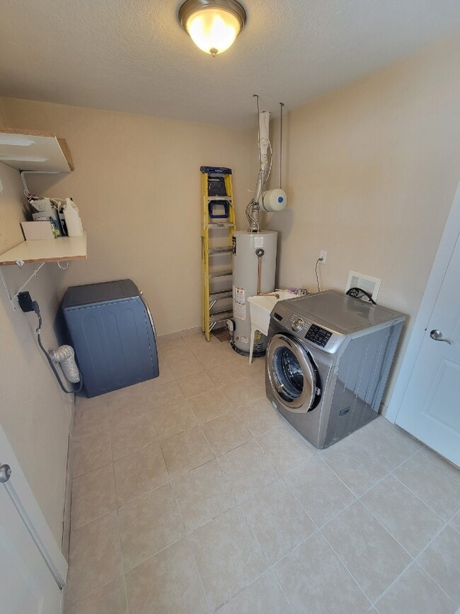 Laundry room with included washer/dryer for your use - 1170 Racine Street