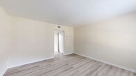 Located at 600 Winston Churchill Dr in Hopewell, Virginia, this two-story home offers a well-organized layout spread evenly across two floors. The main level features an open living area with light-toned luxury vinyl plank flooring and neutral warm-white walls that lend a bright, clean feel throughout. The kitchen is a standout, showcasing gray shaker-style cabinetry, granite-look countertops, and a full suite of stainless steel appliances including a refrigerator, range, and over-the-range microwave. It flows seamlessly into the adjacent dining and living areas, making the space functional for everyday living. A staircase connects to the upper level, where both bedrooms are located. The bedrooms feature plush carpet flooring, ample closet space, and windows that bring in natural light. The spacious primary bedroom offers generous room for furnishings. The full bathroom is finished with light wood-look flooring, a gray vanity with granite-look countertop, and a tub-shower combination. Additional utility and storage spaces, including multiple closets and a utility room, add practical functionality to this well-maintained two-story home.