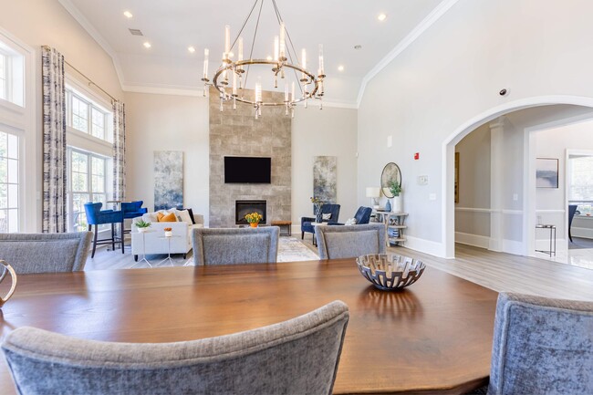 Chandelier and recessed lighting brighten spacious clubroom at Heron Lake - Heron Lake