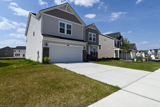 Foto del edificio - "Spacious 5-Bedroom Retreat with Luxurious Quartz Countertops & Fireplace on Deerberg Drive!"