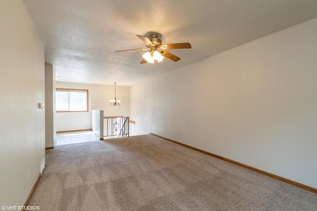 Building Photo - 3 Bedroom townhome, Open Now, garage, 2 bathrooms, W/D Etc.