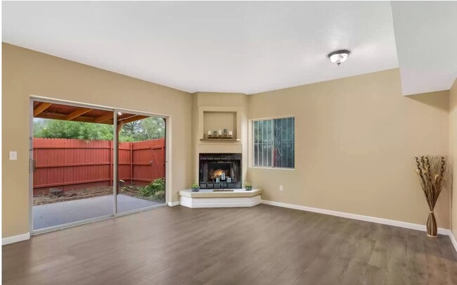 Living Space with Cozy Fireplace - 4965 E Bellevue St