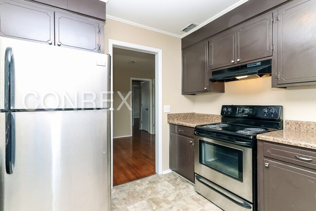 Building Photo - Charming Three Bedroom with Carport