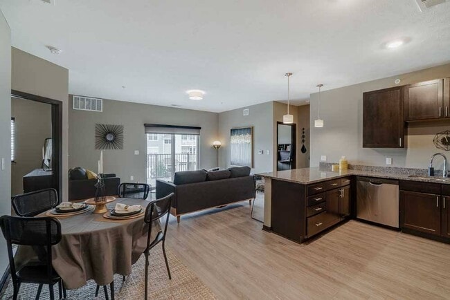 Enjoy a spacious open-plan living area that's just steps away from the kitchen. - WH Flats