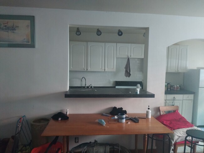 open counter to kitchen. All porcelain tile - 4725 15th Ave NE