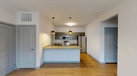 This 790 square foot apartment offers a well-designed living space with two bedrooms and one bathroom. The layout maximizes efficiency, featuring an open-concept design that seamlessly connects the kitchen and living areas. The modern kitchen is a highlight, boasting granite countertops, stainless steel appliances, and ample cabinet space. A central island with a sink provides additional prep space and casual seating.

The primary bedroom, measuring 140 square feet, offers a comfortable retreat with plush carpeting and a spacious closet. The second bedroom, while slightly smaller, also features carpeting and a window for natural light. Both bedrooms have neutral color schemes, allowing for personalization.

The single bathroom is well-appointed with a granite vanity top, large mirror, and modern fixtures. Throughout the apartment, you'll find contemporary finishes, including wood-look flooring in the main living areas and carpeting in the bedrooms. Large windows in the living room and bedrooms allow for plenty of natural light, creating a bright and airy atmosphere.

The apartment's efficient design includes two closets for additional storage. Recessed lighting and modern light fixtures contribute to the overall contemporary feel of the space. Located at 4540 Gender Rd, this single-story apartment combines style and functionality in a compact footprint.