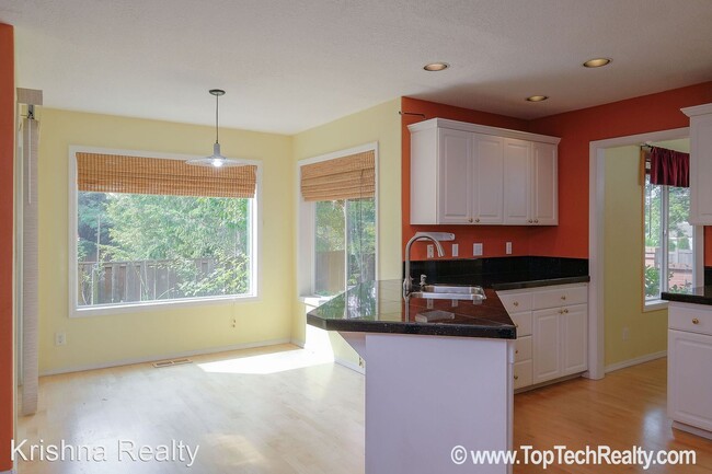 Building Photo - 4 br, 2.5 bath House - 5910 NW Snowlily Dr