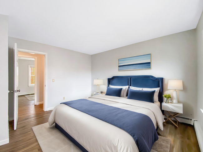 Bedroom featuring Hardwood Floor - Enby Gardens