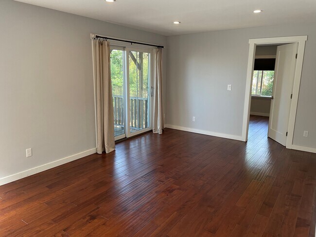 Living room, with sliding door to backyard and door to bedroom - 707 Colusa Ave