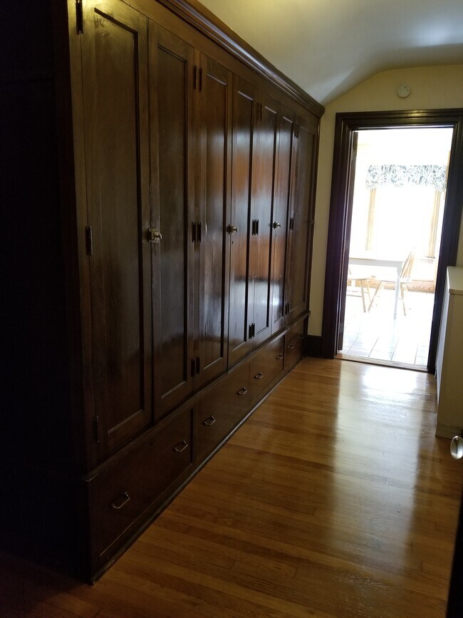 Hallway to kitchen. Full of storage closets! - 3404 Main St