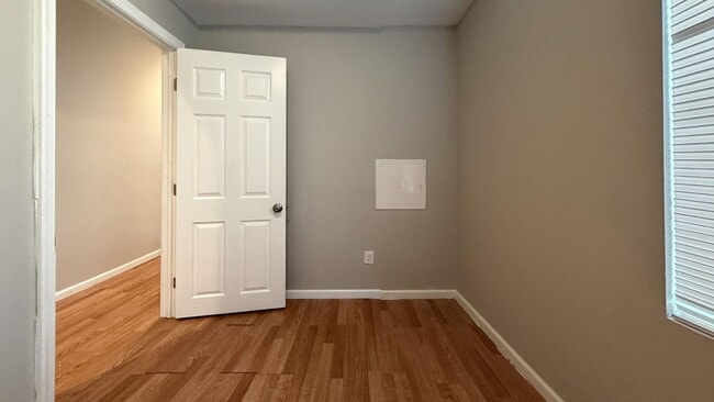 Photo - Charming 4BR/2BA Rowhouse with Hardwood-Style Flooring Throughout
