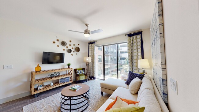 Living Room and Balcony View - Eleven10 at Farmers Market Apartments