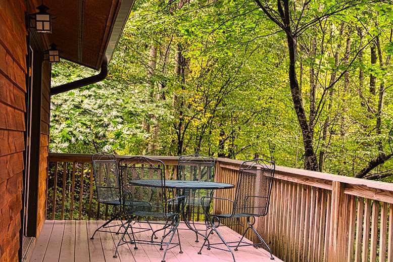 Back deck with table and 4 chairs provided - 328 Cloudrise Ln