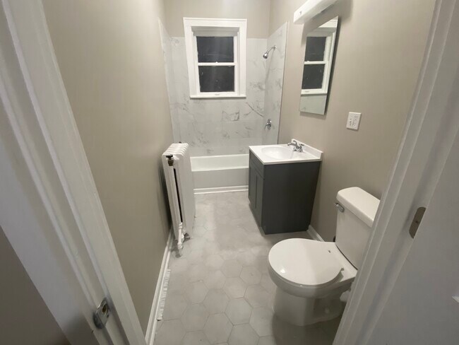 New tile, vanity, toilet and bath tub - 5933 Park Pl
