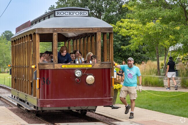 A fun trolley runs alongside the Rock River Recreation Trail in downtown Rockford.