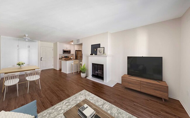 Renovated Package I kitchen, dining, and living area with hard surface flooring - eaves Woodland Hills