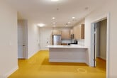 Located at 102 Park Plaza Drive in Secaucus, NJ, this 2-bedroom, 2-bathroom residence offers a thoughtfully designed single-floor layout with a clean, modern aesthetic throughout. Light wood-style flooring flows seamlessly across the living areas and bedrooms, lending a warm and cohesive feel to the space.

The kitchen is a standout feature, boasting light wood cabinetry, stainless steel appliances including a gas range, built-in microwave, and refrigerator, complemented by crisp white quartz countertops and a peninsula with an undermount sink — ideal for both cooking and casual dining.

The spacious primary bedroom provides a generous footprint with natural light streaming through a large window fitted with blinds. The second bedroom is equally well-proportioned, also featuring a window with exterior views. Both rooms offer comfortable living space with ample room for furnishings.

The two full bathrooms are finished in neutral tones. One features large-format beige wall tiles with a soaking tub and shower combination, while the second includes a walk-in shower, wood-toned vanity, and a well-lit mirror above a white countertop. Two closets provide practical storage throughout the unit. The overall ambiance is clean, bright, and move-in ready.