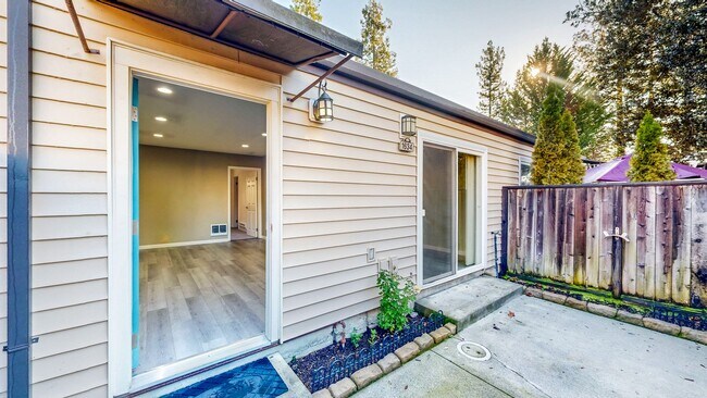 Foto del edificio - Cozy 1 bedroom 1 bath end unit condo with 1 car garage and private patio located next to Peterson...