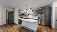 This well-appointed single-floor residence showcases a contemporary design with rich hardwood-style flooring and a neutral color palette carried consistently throughout. The heart of the home is an open-concept kitchen, thoughtfully designed with gray shaker-style cabinetry, a striking herringbone tile backsplash, and a full suite of stainless steel appliances including a range, microwave, dishwasher, and French door refrigerator. A generously sized center island with a clean white quartz countertop offers additional workspace and serves as a natural gathering point. Dramatic black pendant lights hang above the island, complemented by adjustable track lighting overhead. The kitchen flows seamlessly into a spacious living area, which features a ceiling fan and direct access to a private outdoor balcony through large glass French doors, allowing natural light to fill the space. The bedrooms are comfortably sized, each with windows fitted with blinds and ceiling fixtures. The bathrooms are finished in a clean, modern style — one featuring a gray vanity with a framed mirror, and another with a soaking tub and shower combination with a curved curtain rod. Gray door trim and baseboards provide a cohesive, polished finish throughout the entire unit.