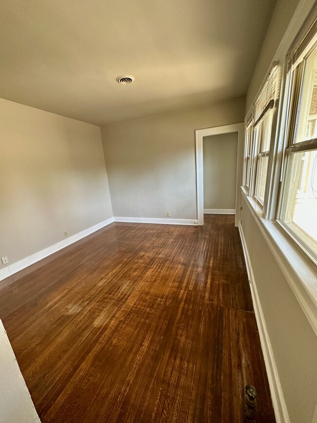 View from kitchen, living room with tons of natural light. - 4901 Washington Blvd