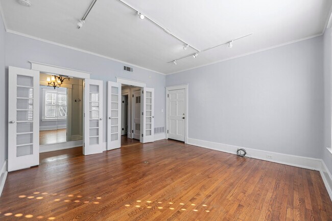Another view of living room, showing large closet & hall leading to kitchen on right. - 3 Park Ln NE