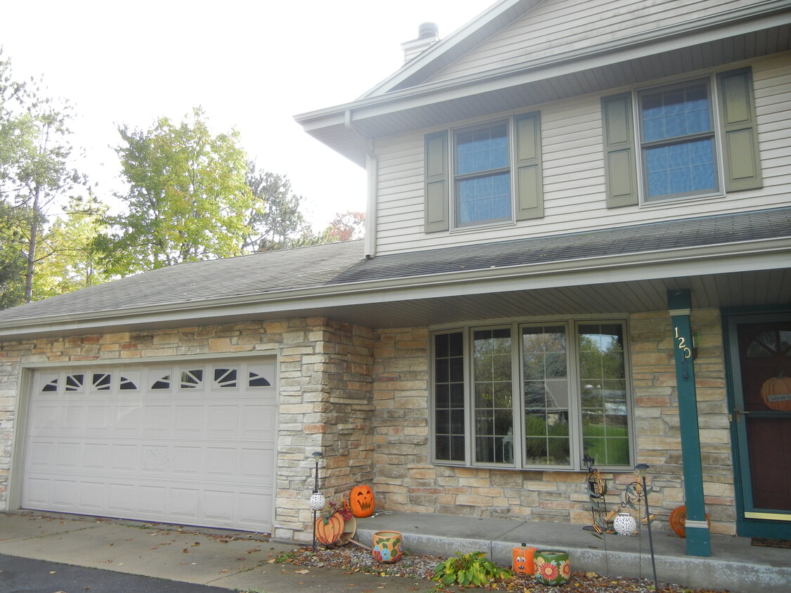 Side of Duplex pictured with 2.5 Car Garage - 120 Hilly Oak Dr