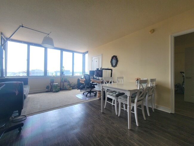 Living room + dining room - 555 Massachusetts Ave NW