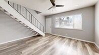 Located in Sacramento, CA, this two-story home offers a well-planned layout spread evenly across two floors. Light wood-tone luxury vinyl plank flooring flows throughout, complemented by soft gray walls and crisp white trim, creating a clean and contemporary aesthetic.

The main floor houses the living room, dining area, and kitchen. The living room is bright and open, featuring a ceiling fan with light, recessed lighting, and a large window that invites natural light. A sleek staircase with black metal railing connects the two levels. The kitchen is efficiently designed with white cabinetry, stone-look quartz countertops, a stainless steel sink, dishwasher, and refrigerator — offering both style and practicality. An in-unit laundry area adds everyday convenience.

Upstairs, the spacious primary bedroom is generously sized, featuring a ceiling fan, recessed lighting, natural light from a large window with outdoor views, and a closet. The full bathroom is elegantly finished with a marble-look tub and shower surround, quartz vanity countertop, white cabinetry, and matching vinyl flooring. Additional closet storage is also available on this level.

This home combines modern finishes with a smart, functional layout, making it an ideal residence in Sacramento.