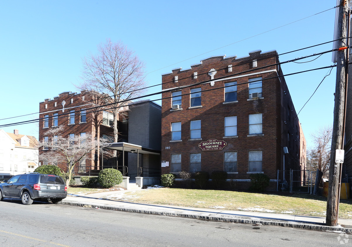 Side of Building Photo - Sigourney Square