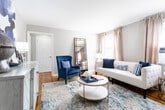 Located at 270 Clermont Terrace in Union, NJ, this single-floor residence combines classic charm with thoughtful modern updates. The layout flows naturally from room to room, offering a cohesive and well-appointed living experience.

The living room serves as a welcoming centerpiece, featuring warm hardwood flooring, neutral walls, and carefully selected furnishings. A bold navy wingback chair pairs with a geometric-patterned credenza and abstract artwork, creating a sophisticated yet approachable atmosphere. A large leaning mirror adds depth to the space.

The kitchen is outfitted with rich dark-wood cabinetry, blue-veined granite countertops, a white subway tile backsplash, and stainless steel appliances. A window allows natural light to brighten the space. Adjacent to the kitchen, a compact dining area accommodates intimate meals, accented by gold-framed chairs and striking wall art.

The bedroom offers hardwood floors, a ceiling fan, natural light through blinds and drapes, and a classic radiator. A closet provides convenient storage within the room.

The bathroom features tile flooring, a dark wood vanity with granite countertop, a tub-shower combination with decorative tile accenting, and a radiator—balancing function with classic detail throughout.