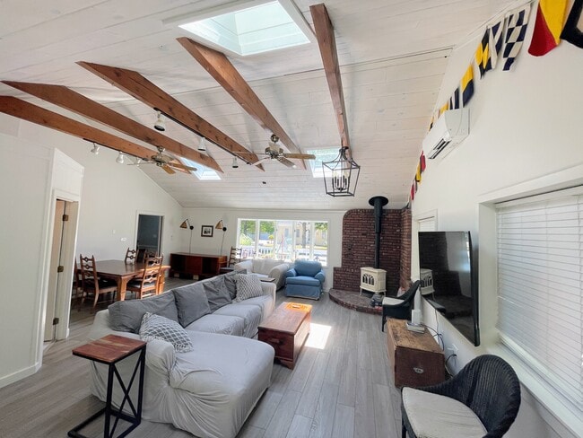Great Room. Living area close up view of seating and fireplace. - 25 Theroux Dr
