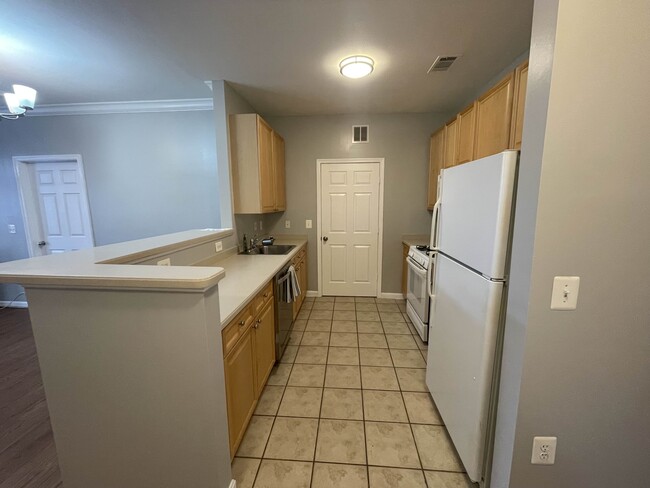 Kitchen with breakfast bar - Laundry room in back - 9480 Virginia Center Blvd