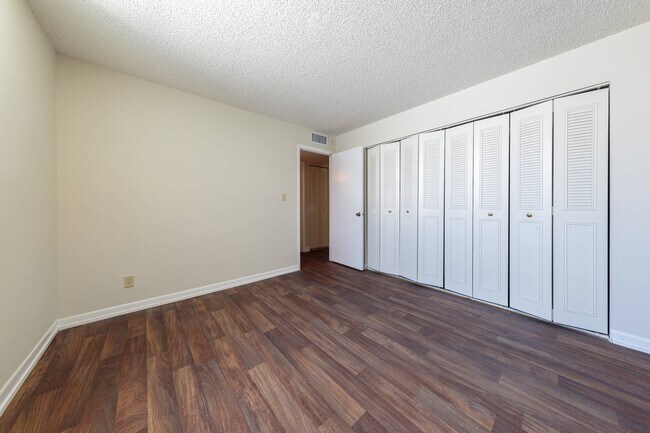 Sunset Palms | Bedroom with Large Close - Sunset Palms Apartments