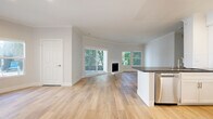 Located at 4636 Cahuenga Blvd in Los Angeles, this well-designed 2-bedroom, 2-bathroom residence offers a thoughtfully planned single-level layout with clean, contemporary finishes throughout. Light wood flooring flows seamlessly through every room, complementing the soft neutral palette that creates a bright, airy atmosphere.

The open-concept living and dining area serves as the heart of the home, featuring crown molding, a classic fireplace, and large sliding glass doors that open to a private balcony with lush greenery views. Multiple windows flood the space with natural light, enhancing its welcoming ambiance.

The kitchen is well-equipped with white shaker cabinetry, dark countertops, a white subway tile backsplash, and a full suite of stainless steel appliances including a gas range, microwave, dishwasher, and refrigerator.

The spacious primary bedroom offers generous room to furnish comfortably, with windows overlooking greenery and access to ample closet space. The second bedroom is equally bright, bathed in natural light through large windows. Both bathrooms are finished with white cabinetry, dark countertops, illuminated mirrors, and tub-shower combinations, maintaining a consistent, polished aesthetic throughout the home.