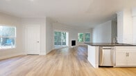 Located at 4636 Cahuenga Blvd in Los Angeles, this well-designed 2-bedroom, 2-bathroom residence offers a thoughtfully planned single-level layout with clean, contemporary finishes throughout. Light wood flooring flows seamlessly through every room, complementing the soft neutral palette that creates a bright, airy atmosphere.

The open-concept living and dining area serves as the heart of the home, featuring crown molding, a classic fireplace, and large sliding glass doors that open to a private balcony with lush greenery views. Multiple windows flood the space with natural light, enhancing its welcoming ambiance.

The kitchen is well-equipped with white shaker cabinetry, dark countertops, a white subway tile backsplash, and a full suite of stainless steel appliances including a gas range, microwave, dishwasher, and refrigerator.

The spacious primary bedroom offers generous room to furnish comfortably, with windows overlooking greenery and access to ample closet space. The second bedroom is equally bright, bathed in natural light through large windows. Both bathrooms are finished with white cabinetry, dark countertops, illuminated mirrors, and tub-shower combinations, maintaining a consistent, polished aesthetic throughout the home.