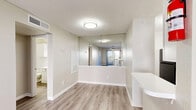 Located at 14531 Ella Blvd in Houston, TX, this one-bedroom, two-bathroom unit offers a thoughtfully organized single-floor layout that makes efficient use of its space. Light-toned wood-look flooring runs consistently throughout, complementing the neutral wall palette and white trim to create a clean, cohesive aesthetic.

The living room is bright and airy, featuring a ceiling fan and a sliding glass door that opens directly onto a private patio, allowing natural light to flow freely into the space. Adjacent to the living area, the combined dining room and kitchen is well-equipped with white cabinetry, light countertops, a stainless steel sink, and a black electric range with overhead ventilation — all supported by a dedicated pantry for additional storage.

The bedroom is comfortably sized, fitted with a ceiling fan and a window that brings in natural light. A dedicated closet provides organized storage space. The unit includes two full bathrooms, each featuring wood-look flooring, a tub-shower combination, vanity with sink, and classic white fixtures. A hallway connects the private areas of the unit, contributing to a functional and intuitive flow throughout the home.