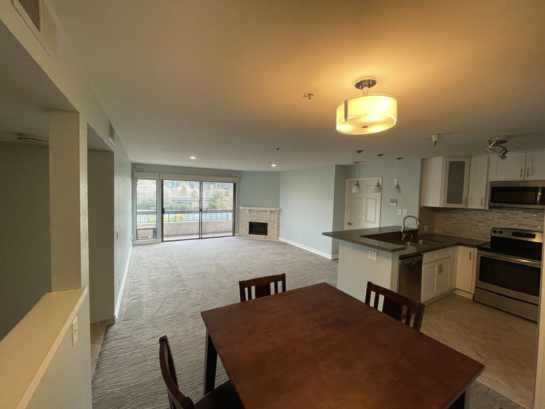 Kitchen and living room, from dining area (table just for perspective) - 5665 Friars Rd