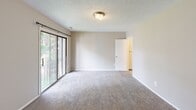 Located at 98 Oak St in Lindenwold, NJ, this multi-level home spans three floors and offers a practical, well-organized layout throughout. The living areas are finished with neutral-toned carpeting that creates a warm and cohesive feel across multiple rooms. A chandelier accent in the dining area adds a touch of character, while the open flow between the main living and dining spaces provides a comfortable sense of room.

The kitchen is equipped with warm oak cabinetry, light countertops, a single-basin stainless steel sink, and a dishwasher, offering ample storage and functional workspace. Bedrooms are generously sized with plush carpeting, textured ceilings, and large windows that invite natural light. Several bedrooms include sliding glass doors that open to outdoor views of surrounding trees, enhancing the connection to the outside. Closet space is abundant, with multiple built-in closets featuring sliding doors visible in the bedroom areas.

The bathrooms are clean and efficiently designed, featuring white vanities with under-cabinet storage, well-lit mirrors, and at least one full bath with a tub-shower combination and wood-look vinyl flooring. Throughout the home, neutral wall tones and textured ceilings maintain a consistent, understated aesthetic suited for comfortable everyday living.