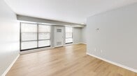 Located at 1321 Veterans Hwy in Bristol, PA, this well-appointed one-bedroom, one-bathroom unit offers a clean, modern aesthetic across its single-floor layout. Light wood vinyl flooring runs throughout, creating a warm, cohesive feel in every room. The living room is generously sized, featuring large windows that allow abundant natural light to pour in, along with a private entry door that connects directly to the exterior. The updated kitchen is a standout feature, showcasing white shaker-style cabinetry, marble-look countertops, a classic subway tile backsplash, and a full suite of stainless steel appliances including a gas range, over-the-range microwave, dishwasher, and refrigerator. The bedroom offers a comfortable footprint with a natural light-filled window and extensive built-in closet storage along one full wall, maximizing organization. An additional dedicated closet provides even more storage flexibility. The bathroom is neatly finished in white, featuring a tub-shower combo, a white vanity, and wood-look flooring that ties seamlessly into the rest of the unit. Soft gray walls throughout lend a calm, neutral palette that complements the bright, airy character of the space.