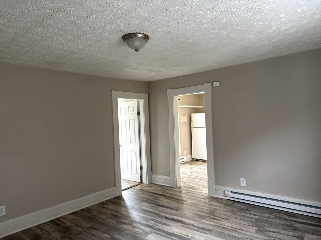 Living room leading to bathroom and kitchen - 233 Washington Ave