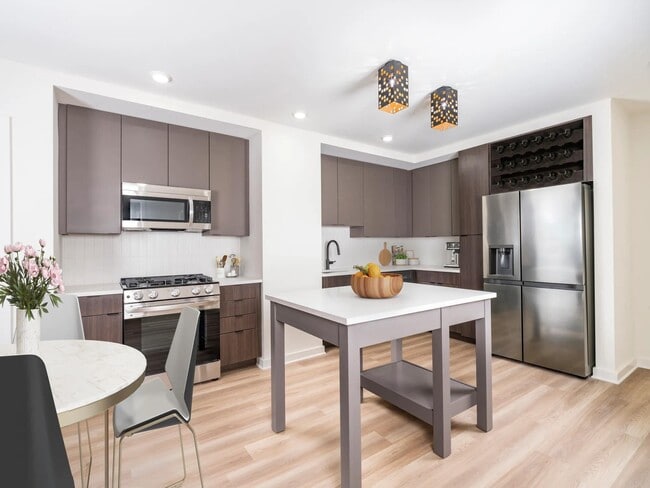 Discover your dream home at Modera Parkside! Our premium collection homes feature elegant under-cabinet kitchen lighting, distinctive fixtures, upgraded countertops, a stylish tile backsplash, and a captivating two-tone cabinet finish that elevates your living experience in Midtown Atlanta. - Modera Parkside