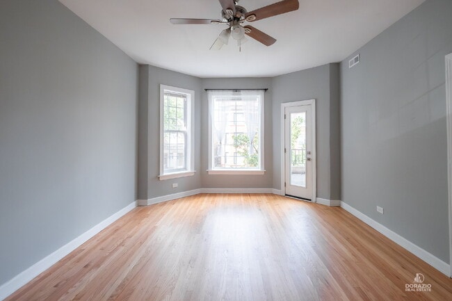 Building Photo - Modern 4BR Apartment with Hardwood Floors, Balcony & Central A/C