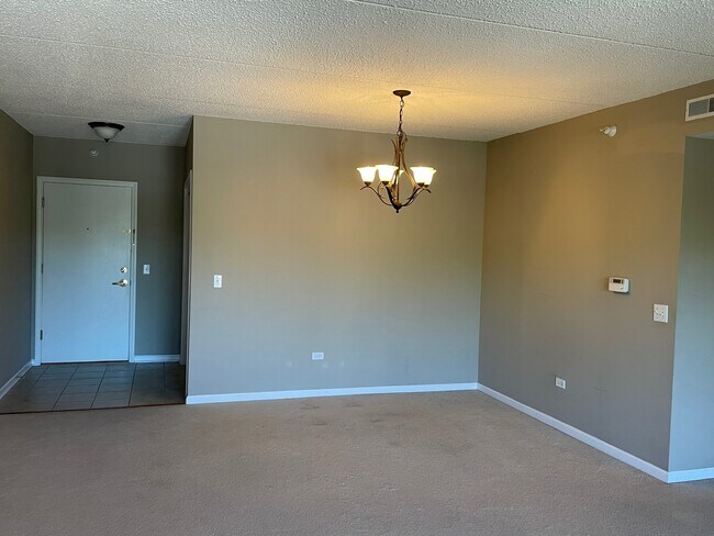 Front entrance and dining area with chandelier - 5 W Central Rd