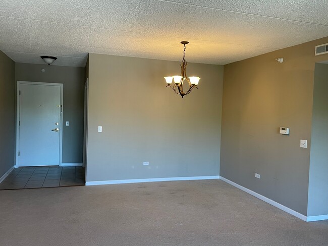 Front entrance and dining area with chandelier - 5 W Central Rd